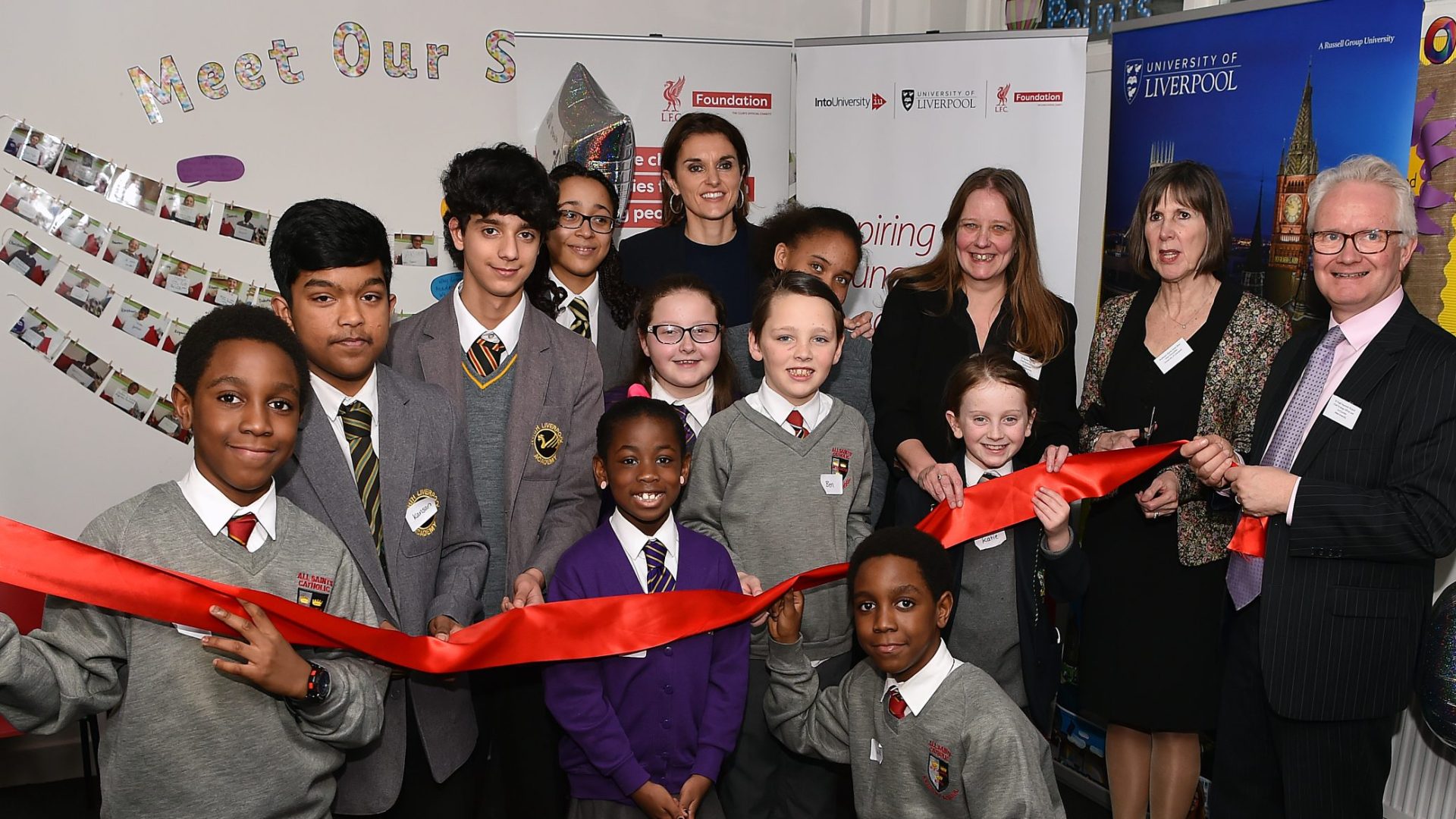 Students, staff and representatives from the University of Liverpool and the LFC Foundation celebrate the launch of IntoUniversity North Liverpool.